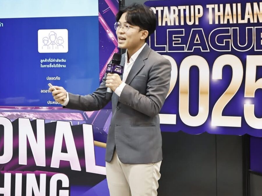 InnoEM student pitching on stage at the Startup Thailand League competition